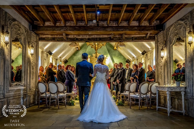 A bride and her dad walking down the aisle