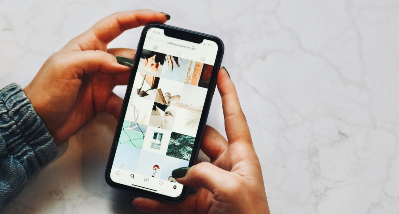 close up image of hand holding a phone