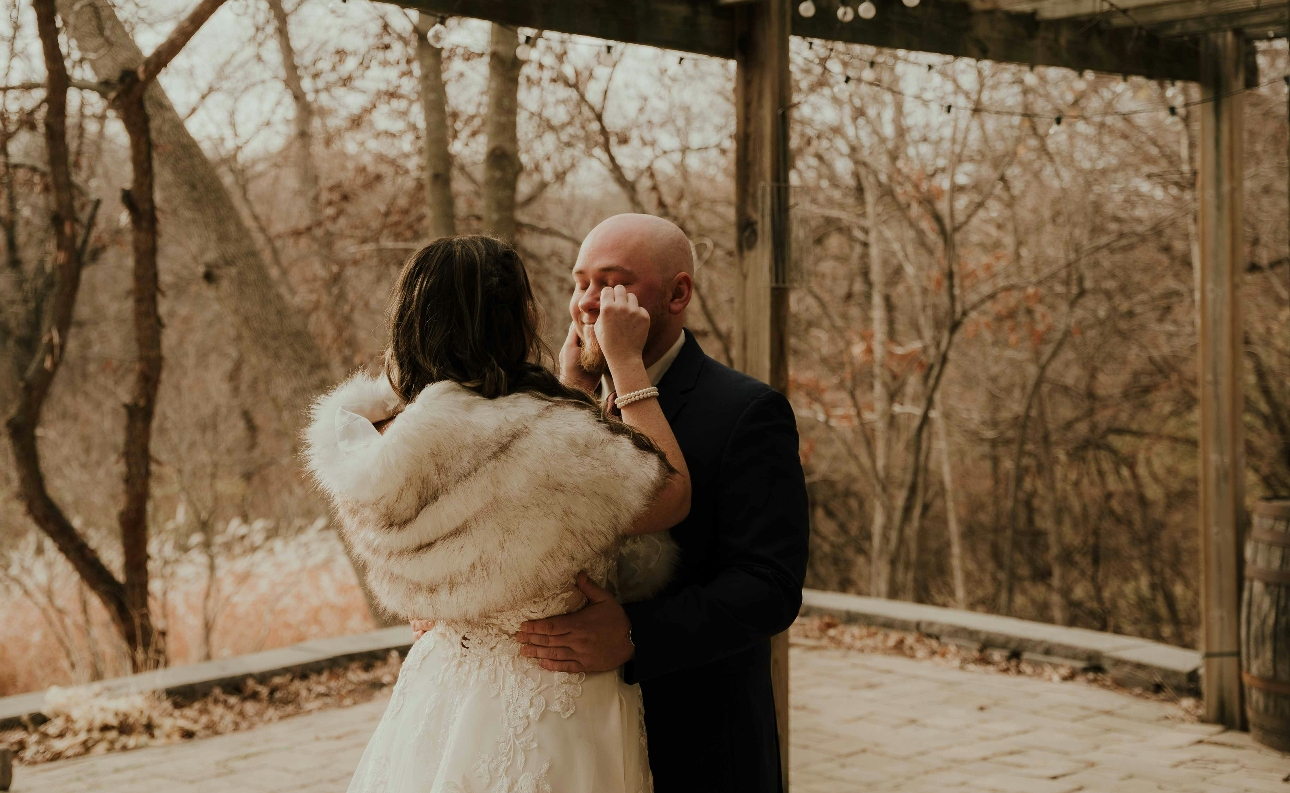 bride and groom in winter embracing